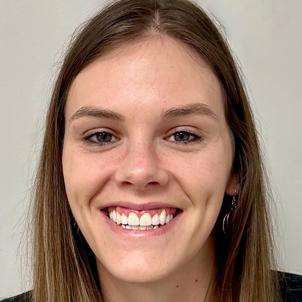 Young woman with beautiful smile after treatment at Carolina Complete Dental