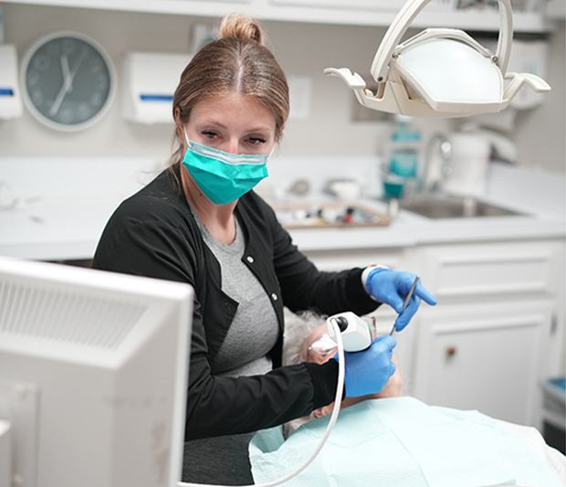 Team member at Carolina Complete Dental using digital scanner in patient’s mouth