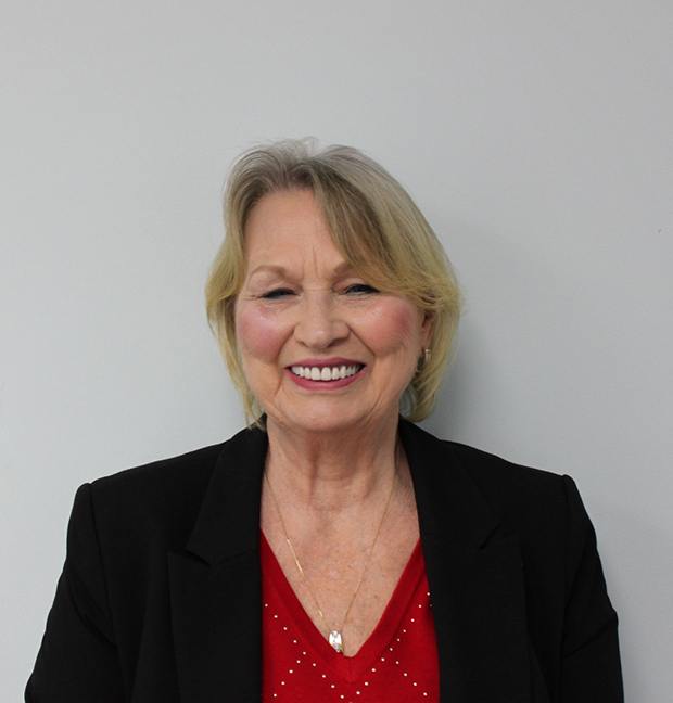 Portrait of senior woman with beautiful teeth after treatment at Carolina Complete Dental