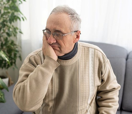 Senior man suffering from dental pain