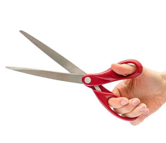 Hand holding a pair of scissors