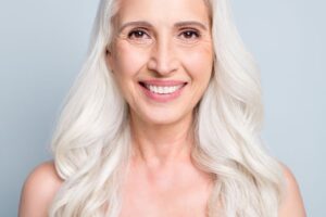 Portrait of smiling senior woman with beautiful teeth